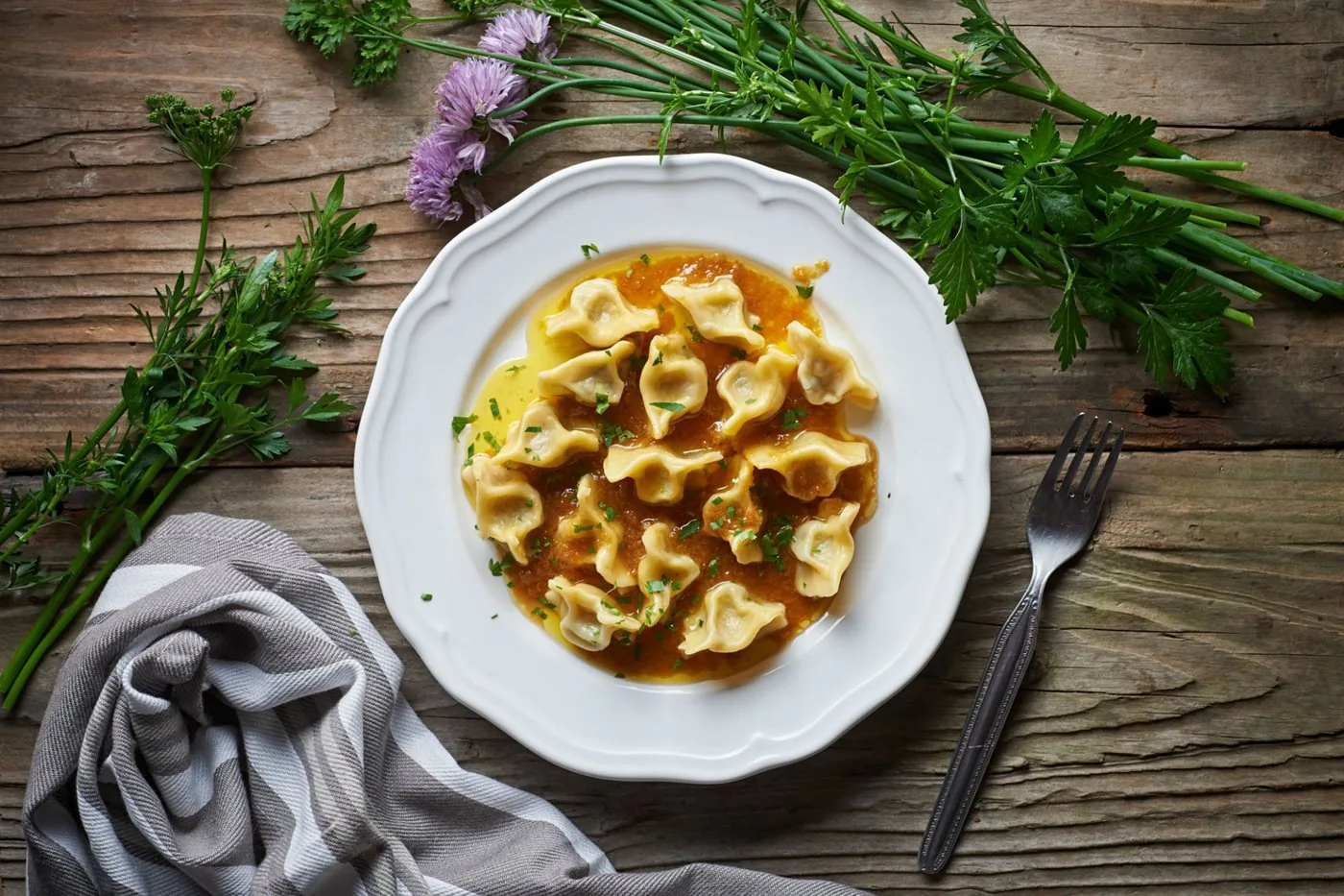 Idrijski žlikrofi served with a meat sauce