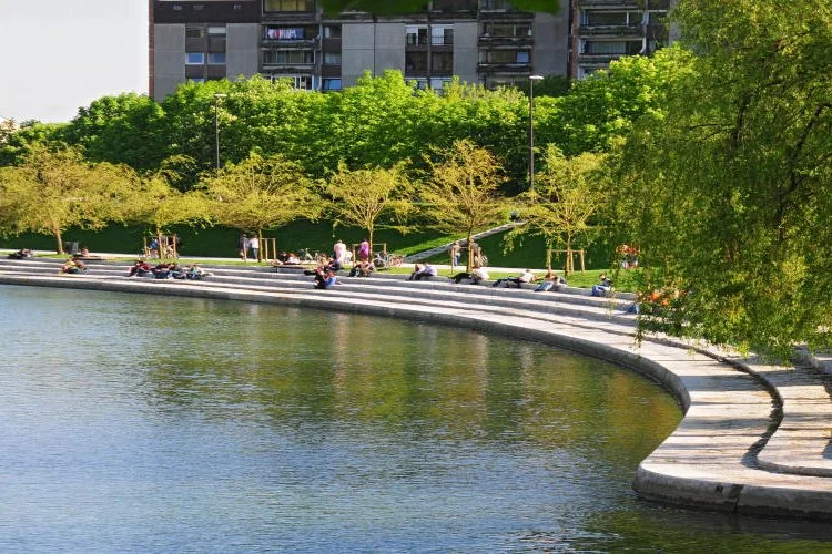 People beside the river at Trnovski pristan in Ljubljana